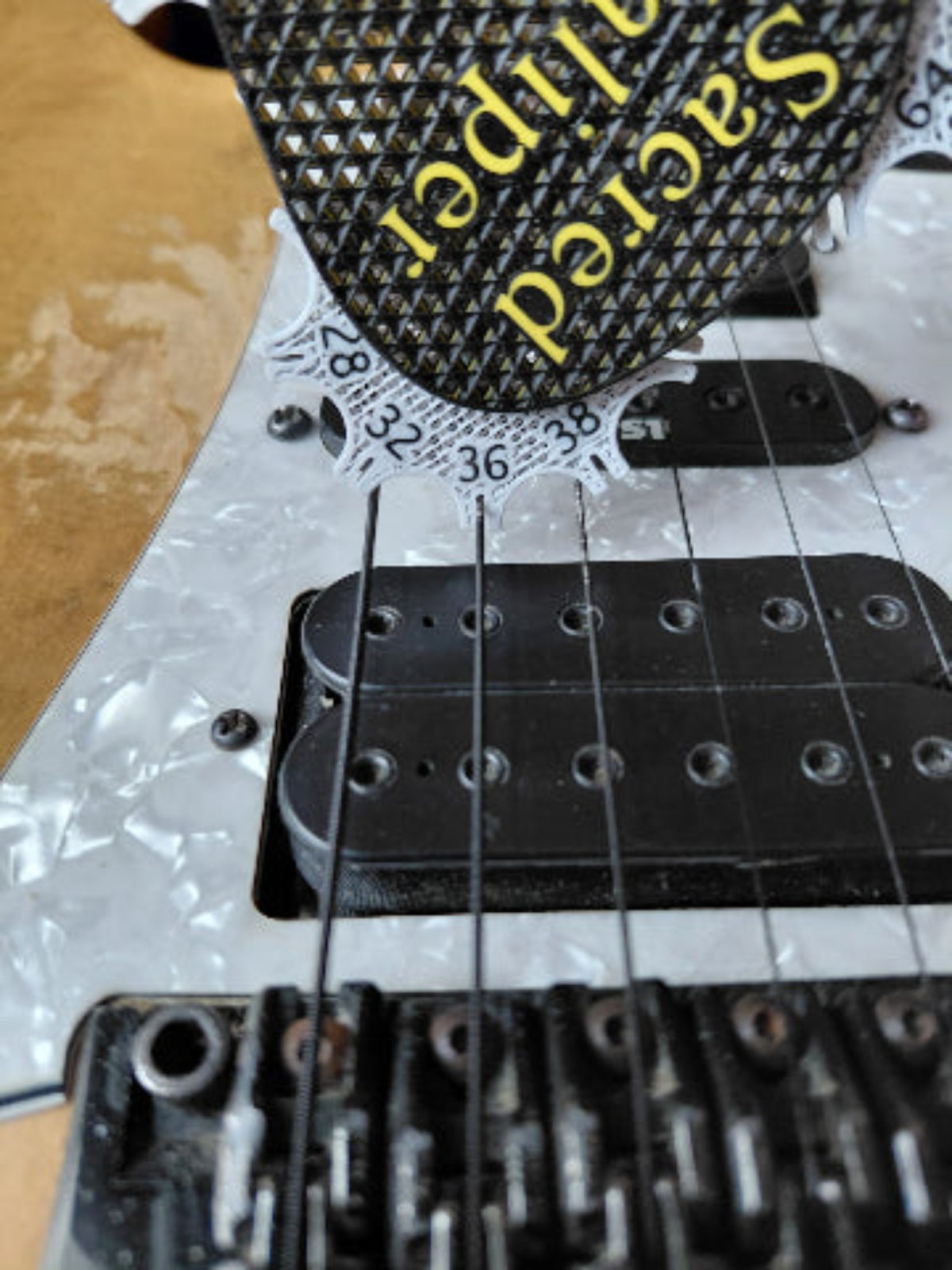 Sacred Kaliper Guitar String Gauge Tool.